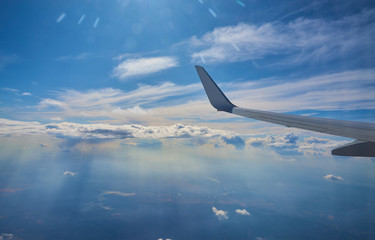 Aerial landscape of clouds from the window of an airplane