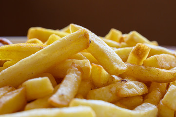 Yummy french fries as background. Flat lay. Potato french fries. Close up french fries. Copy space.