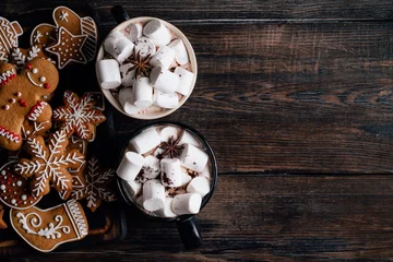 Foto auf Alu-Dibond Christmas home atmosphere, cafe, celebration. Cozy and warming winter drink. Hot chocolate with melting marshmallows and homemade delightful festive sweets, copyspace © Vadym