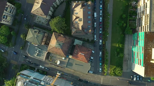sunset light flight over lausanne city traffic street aerial topdown panorama 4k switzerland