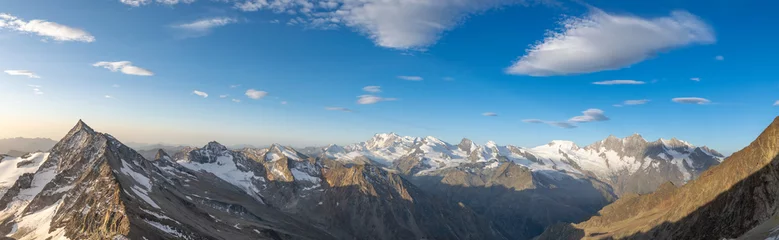 Fototapeten Grau XXL wide angle Swiss alps panorama view Left to right: Portjenhorn & Pizzo D'Andolla, Sonnighorn, Stellihorn, Monte Rosa, Strahlhorn, Rimpfischhorn, Allalinhorn, Alphubel, Taeschhorn, Dom, Nadelhorn.  © Juergen Wallstabe
