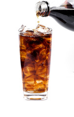 Cola in a glass with ice cubes to refresh and quench thirst
