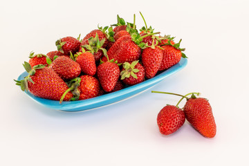 Strawberries in a plate isolated on white