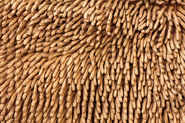 Brown doormat and surface