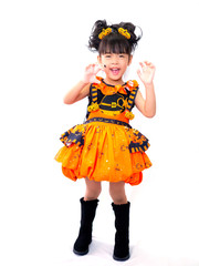 Asian children girl in pumpkin dress costume for Halloween decoration in white background