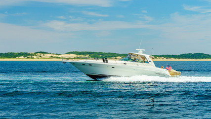 Fototapeta premium Provincetown, Cape Cod, Massachusetts, US - August 15, 2017 Boat and his crew looking for a whale
