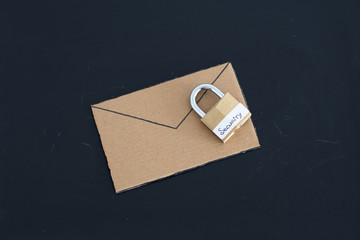 user privacy concept, email envelope miniature on desk with lock labelled security on it