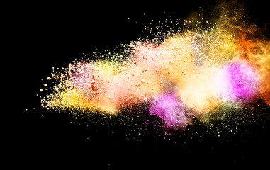 Explosion of colored powder isolated on black background. Abstract colored background. holi...