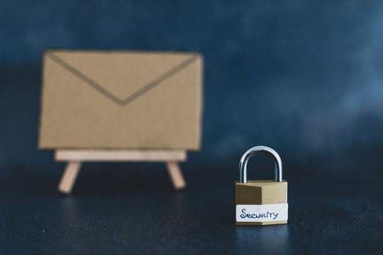 user privacy concept, email envelope miniature on easel with lock labelled security in front of it
