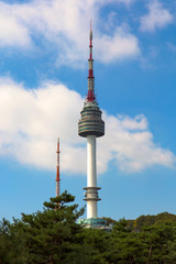 Fototapeta premium Seoul tower Located on Namsan Mountain with blue sky white clouds in Seoul, South Korea.