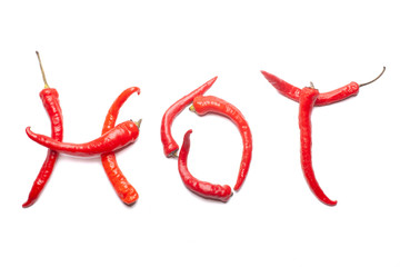 red hot chili peppers in shape of word HOT isolated on white background, photo