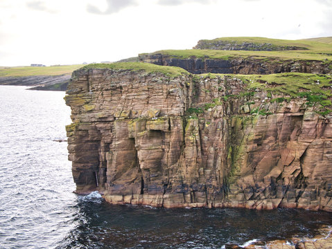 Sandstone cliffs on the East Shetland coast near Levenwick - the bedrock is part of the Bressay Flagstone Formation, consisting of Sandstone and Argillaceous rocks, interbedded. Sedimentary Bedrock fo