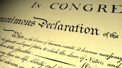 Declaration of independence of USA. Handwritten text by Thomas Jefferson and adopted by 2nd Continental Congress in Philadelphia on July 4th, 1776. Cinematic close-up panorama from title.