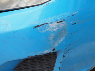 blue car of accident collisions and decay, peeling off and cracking colors, Headlight are old and...