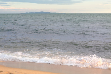 Sand beach water surf. Blue sea wave.