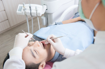 Fototapeta premium Dentists with a patient during a dental intervention. Dentist Concept