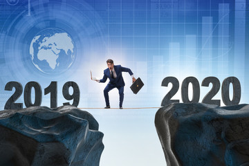 Businessman on tight rope from year 2019 to 2020