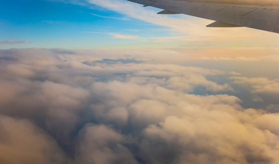Fototapeta na wymiar clouds in dramatic sunset. Travel fly cruise