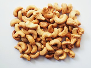 Dried cashew nuts isolated on white background.