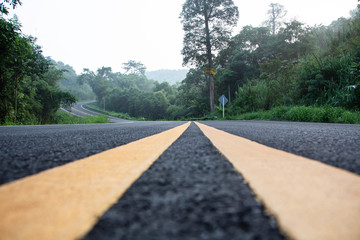 Asphalt road with yellow double dividing line