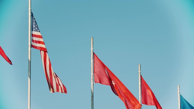 Flags of USA and Turkey blowing in the wind
