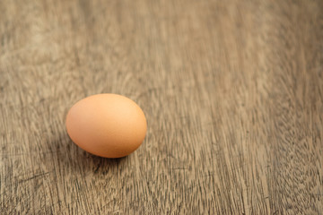 Eggs on the wooden background and copy space