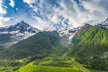 Spectacular landscape of alpine mountains and green meadow at Chamonix