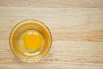 Eggs in a cup Lay on the wooden background and copy space