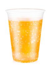 Orange carbonated drink with ice in a plastic cup isolated on white background