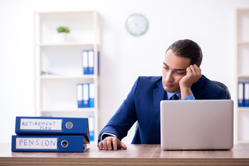 Young male accountant working in the office