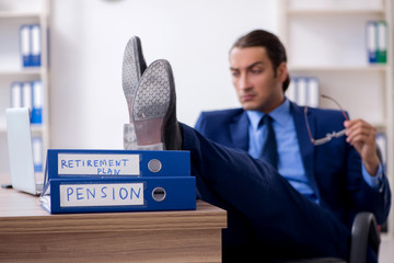Young male accountant working in the office