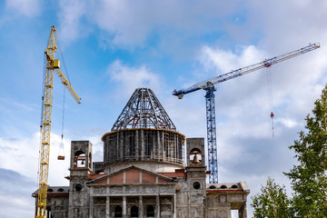 building under construction. construction cranes at a construction site