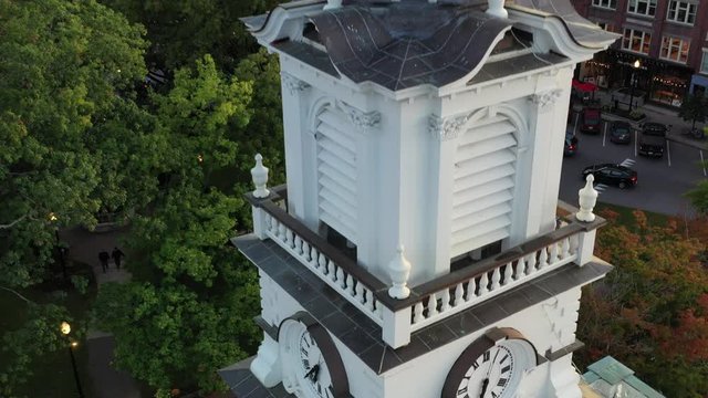 Aerial drone shot close up to white wooden church steeple in downtown Keene, NH