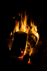 Fire burning at night, black background