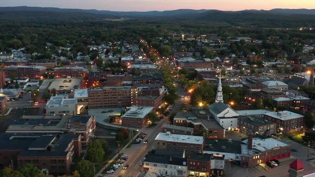 Aerial view of downtown Keene, New Hampshire at dusk with city lights