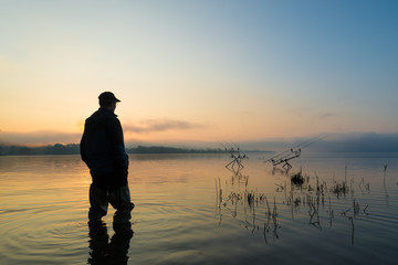 Fishing adventures, carp fishing at sunset. Active lifestyle concept
