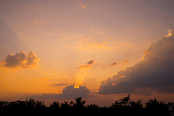 Fiery sunset landscape with darkness foreground in siem reap city in Cambodia during rainy season 