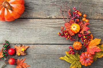 Autumn background with artificial leaves and decorations. Top view.