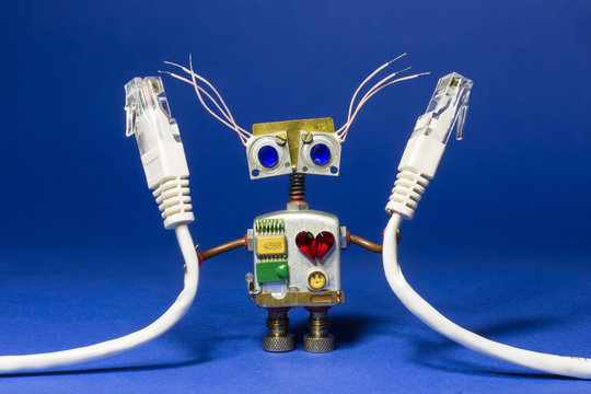 Robot toy with computer internet wires in his hand.