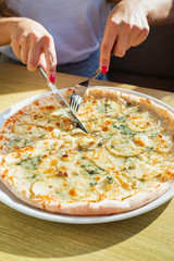 woman eating pizza in the cafe