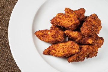 chicken nuggets on the white plate