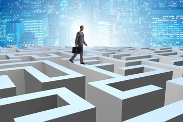 Businessman trying to escape from maze