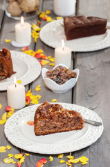 Piece of nut cake on wooden table