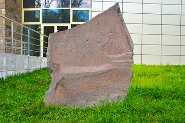 Ancient drawings on stones of the Asian steppe. Permission is not necessary. The stone is installed near the Museum, for universal access. Russia. Khakassia. Abakan