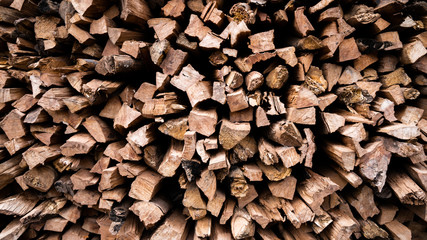 Firewood Wall Natural wood background. Firewood stacked in several row.For background.