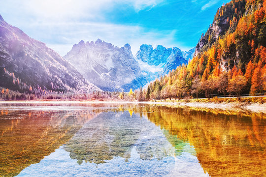 Beautiful seasonal Aurumnal scenery of mountain lake in Dolomite Alps in Italy. Beautiful Alpine landscape. Autumn in Alps.