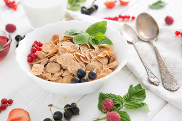 Multigrain wholewheat healthy cereal. Healthy tasty breakfast multigrain wholewheat healthy cereals with strawberries, raspberries, black currants and red currants.