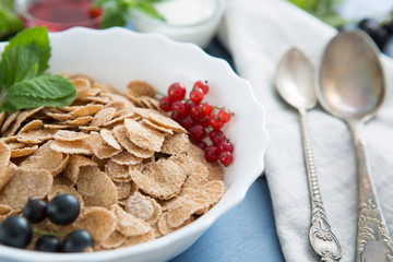 Multigrain wholewheat healthy cereal. Healthy tasty breakfast multigrain wholewheat healthy cereals with strawberries, raspberries, black currants and red currants.
