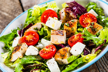Caesar salad on wooden table