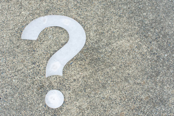 White Question mark on concrete concept - decisions, uncertainty, choice in life or business. Copy...